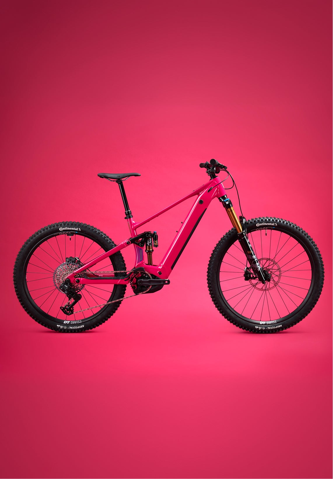 Red Rossignol After Hours electric mountain bike shown in side view, featuring full suspension, wide tires, and a sturdy frame on a plain red background.