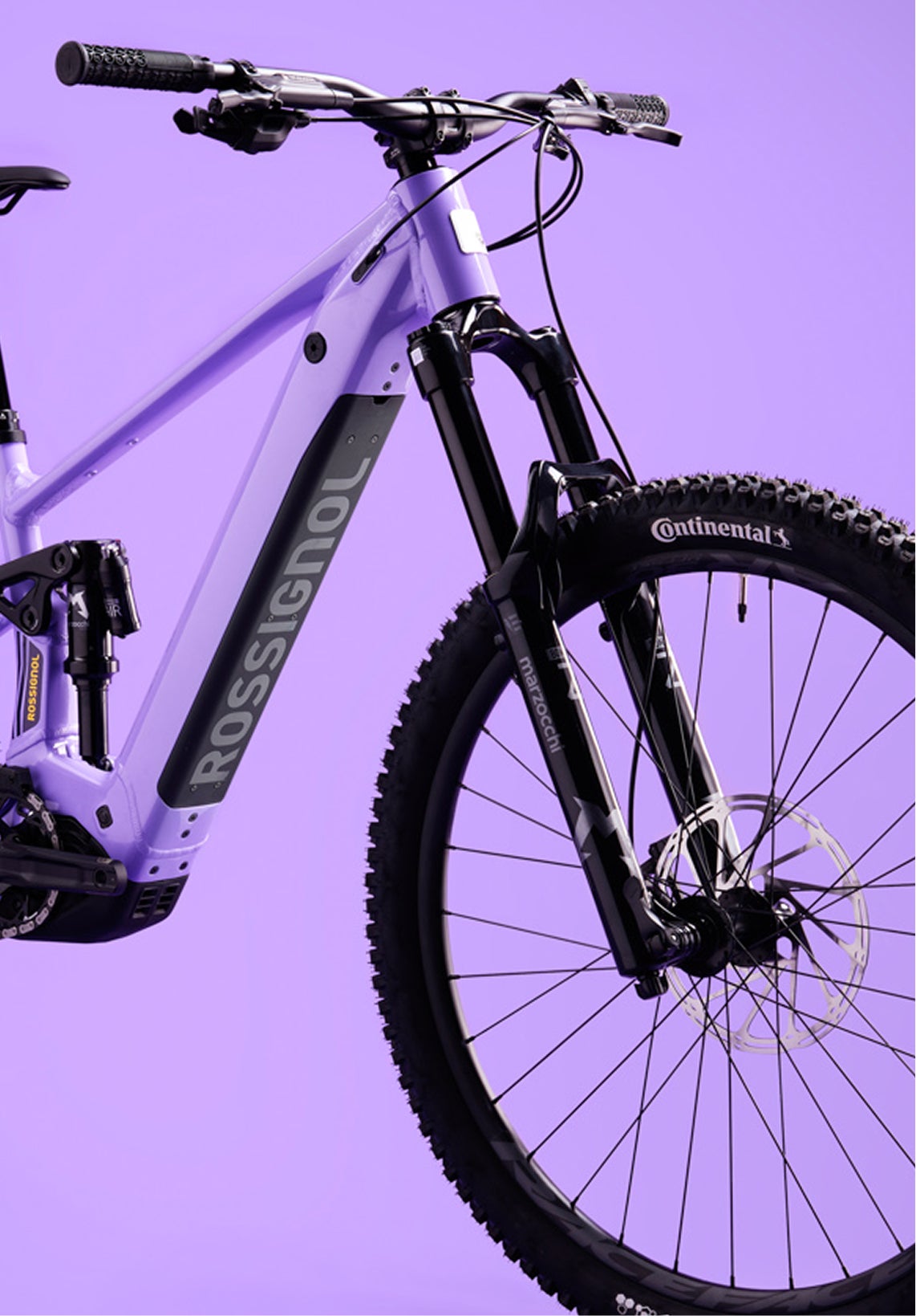 Close-up of the front section of the Rossignol After Hours Eagle 90, showing the purple frame, black suspension fork, front wheel, handlebars, and Rossignol logo on the down tube.