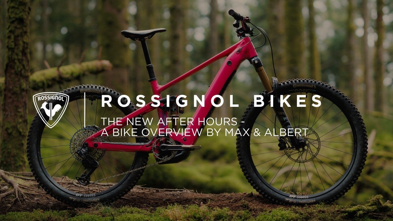 Video showing some riders on a Rossignol electric mountain bike navigating technical forest trails, riding over rocky sections and taking turns on dirt paths surrounded by trees.