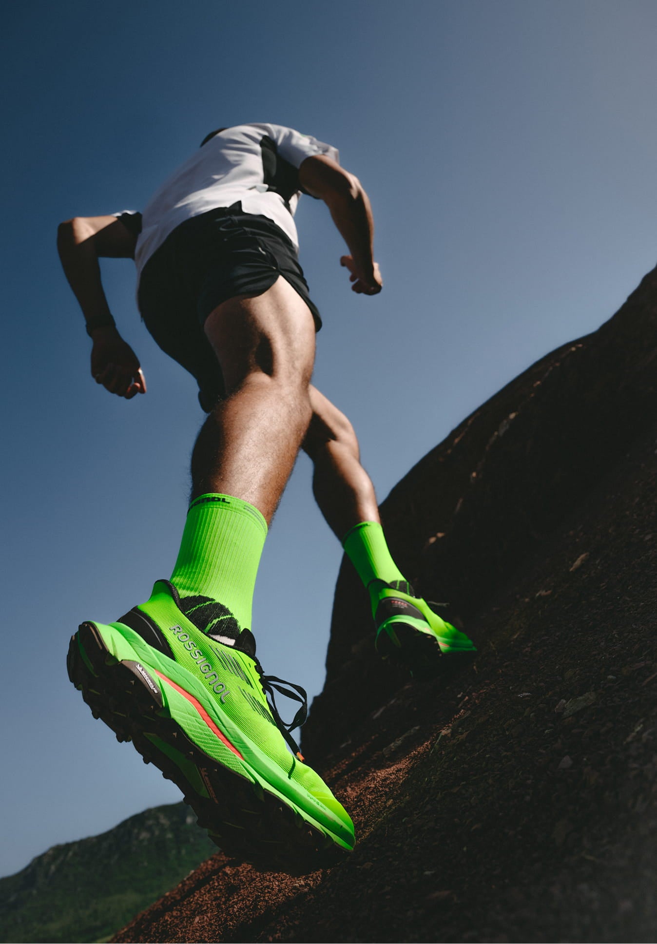 Close-up of an athlete’s feet climbing uphill wearing Rossignol VEZOR shoes