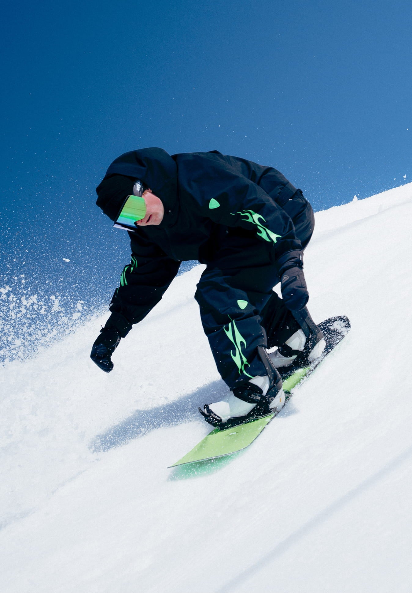 Snowboarder riding downhill wearing the Rossignol ALLTRACK 2L SHELL JACKET