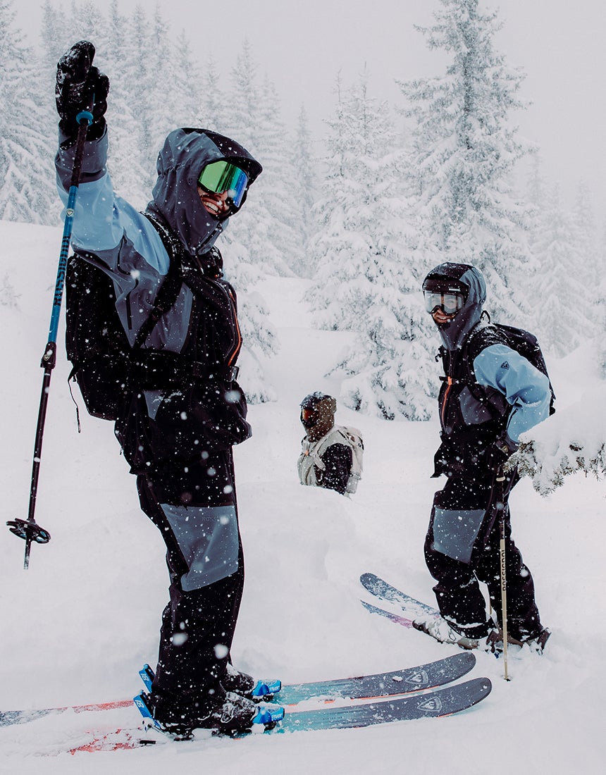 Rossignol Proclivity 3L Shell ski jacket in action during powder skiing in a snowy mountain resort