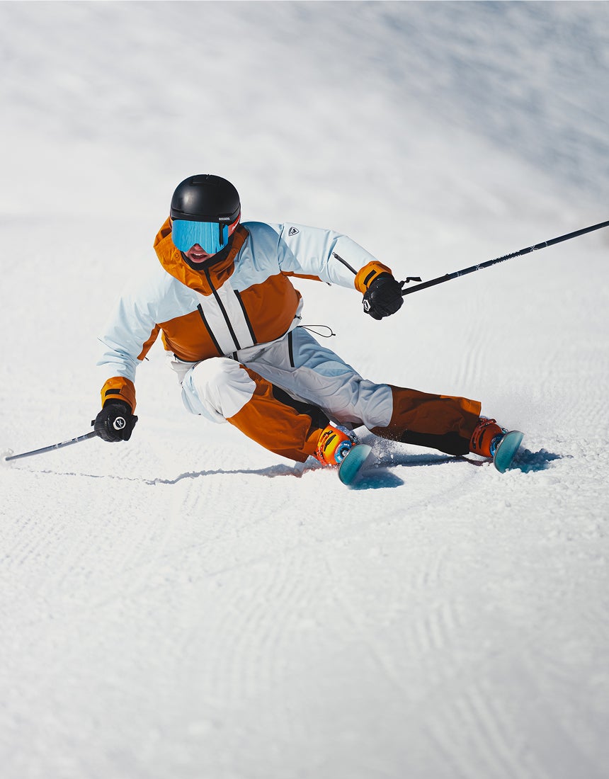 Rossignol Proclivity 3L Shell women’s ski jacket worn during an alpine ski turn on a snowy slope