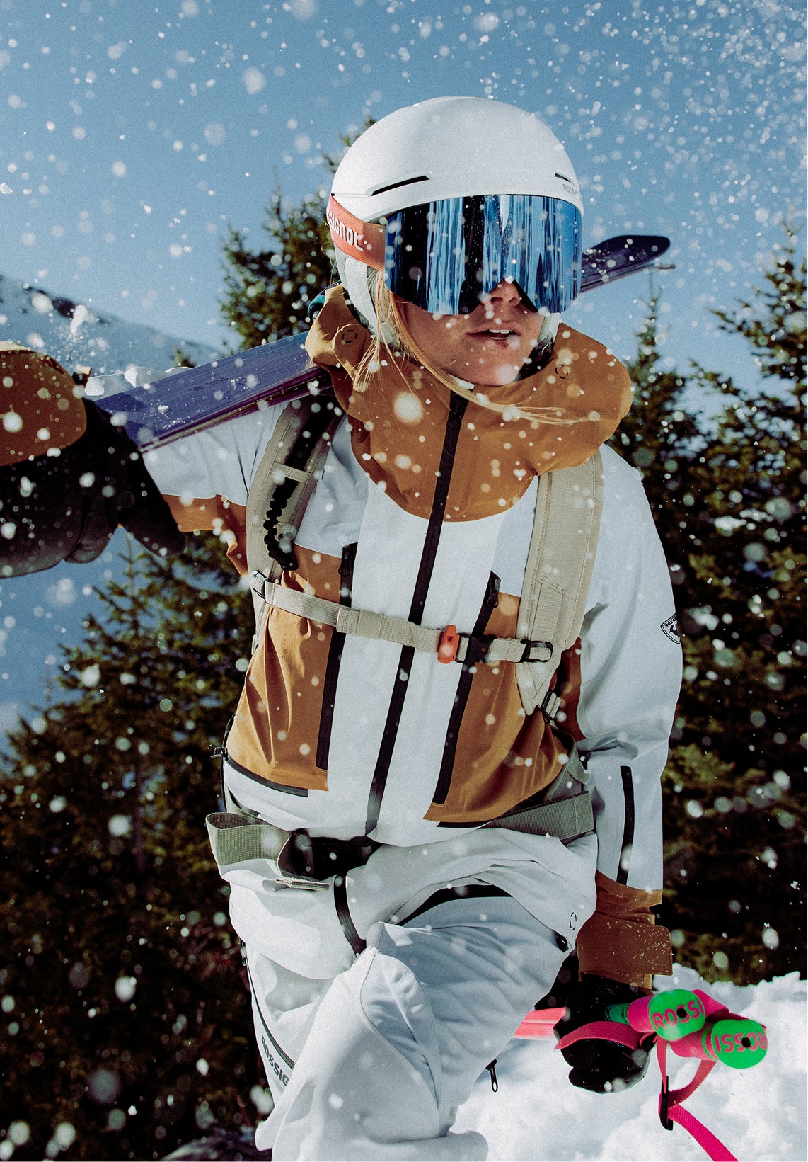 Rossignol Proclivity 3L Shell ski jacket for women in white and brown worn in snowy mountains