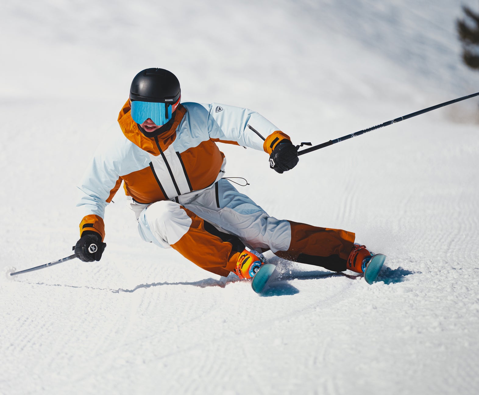 Rossignol Proclivity 3L Shell women’s ski jacket in action with ski poles in deep mountain snow