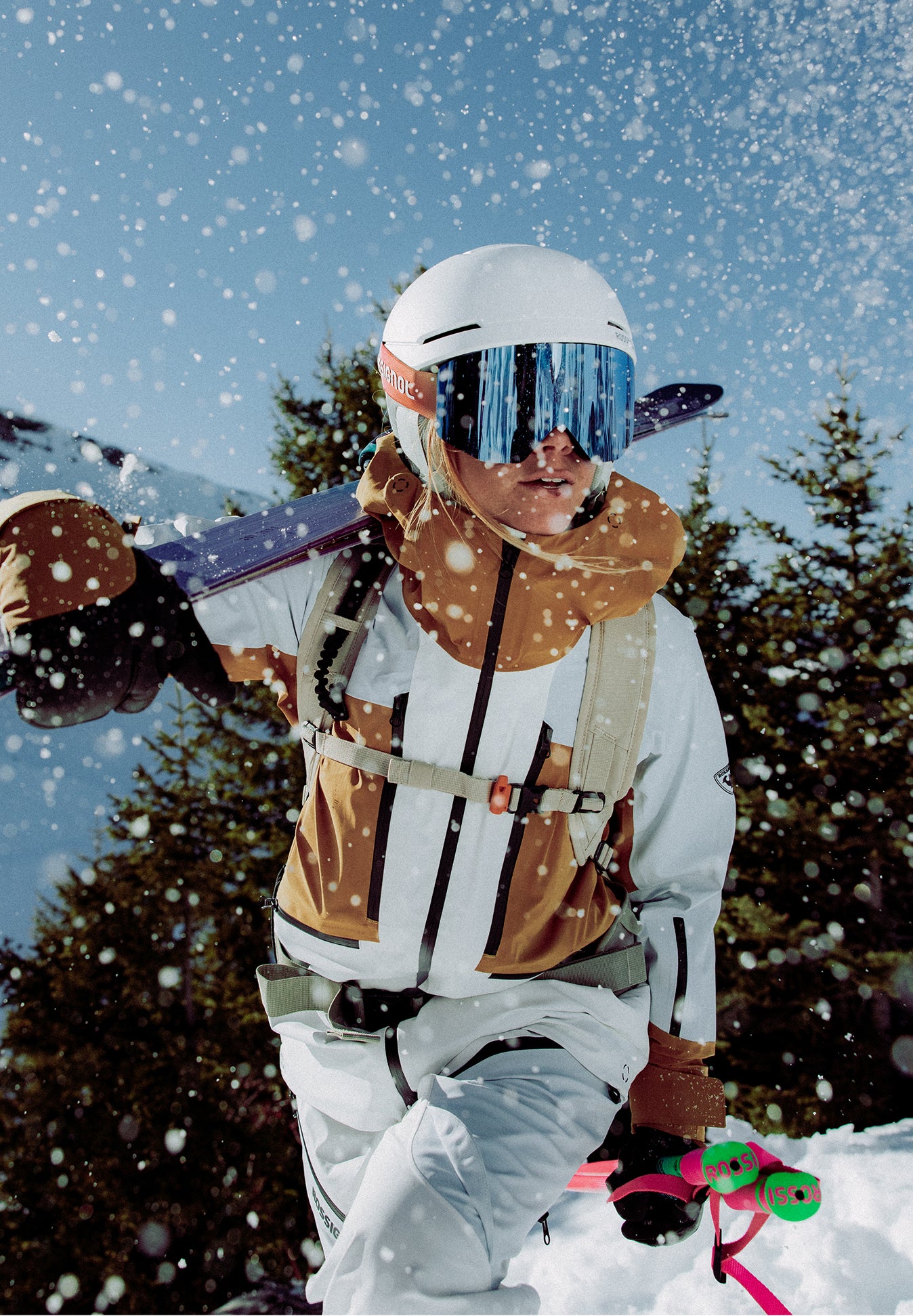 Rossignol Proclivity 3L Shell ski jacket for women in white and brown worn in snowy mountains