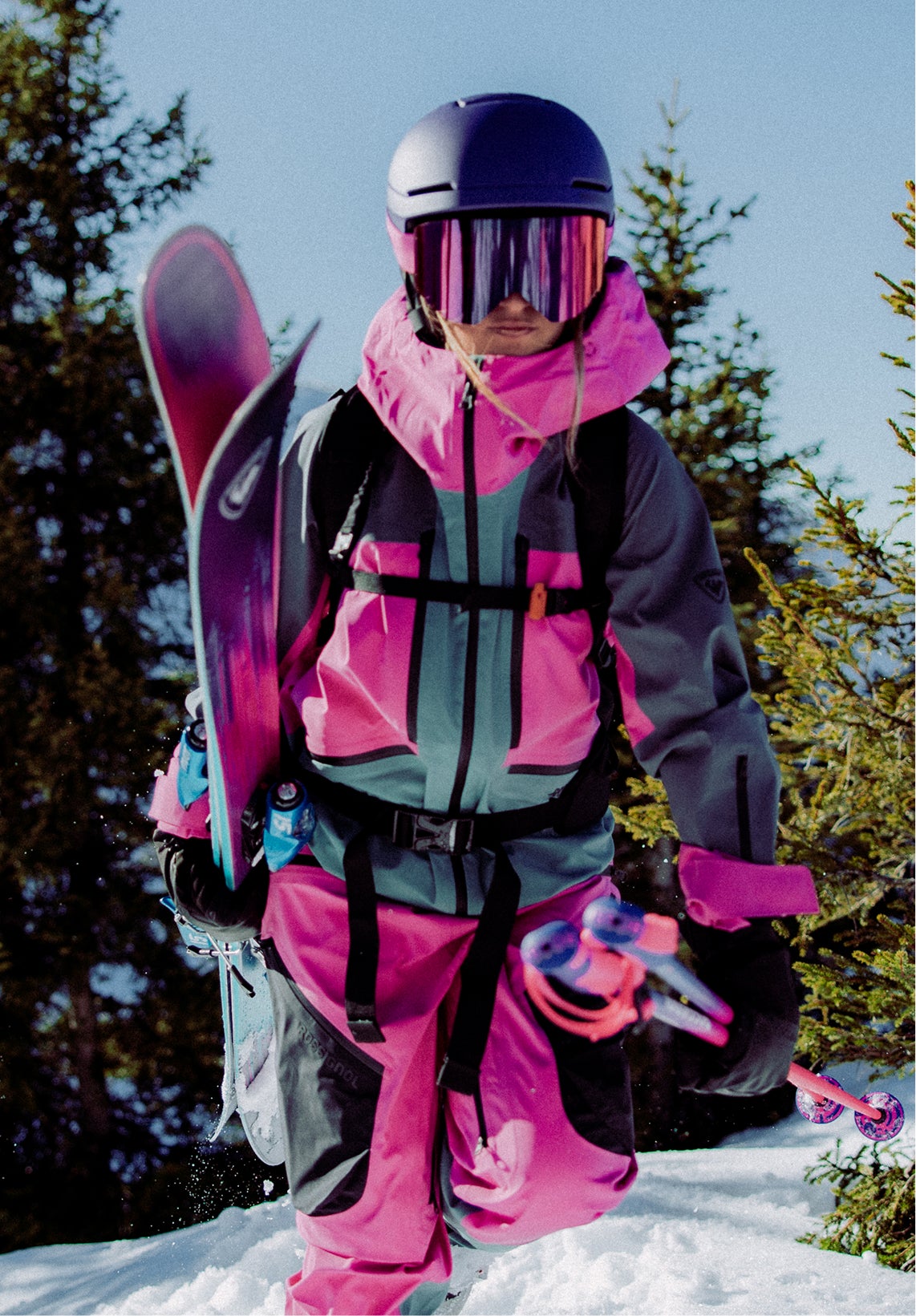 Rossignol Proclivity 3L Shell ski jacket for women in pink and purple worn in snowy mountains