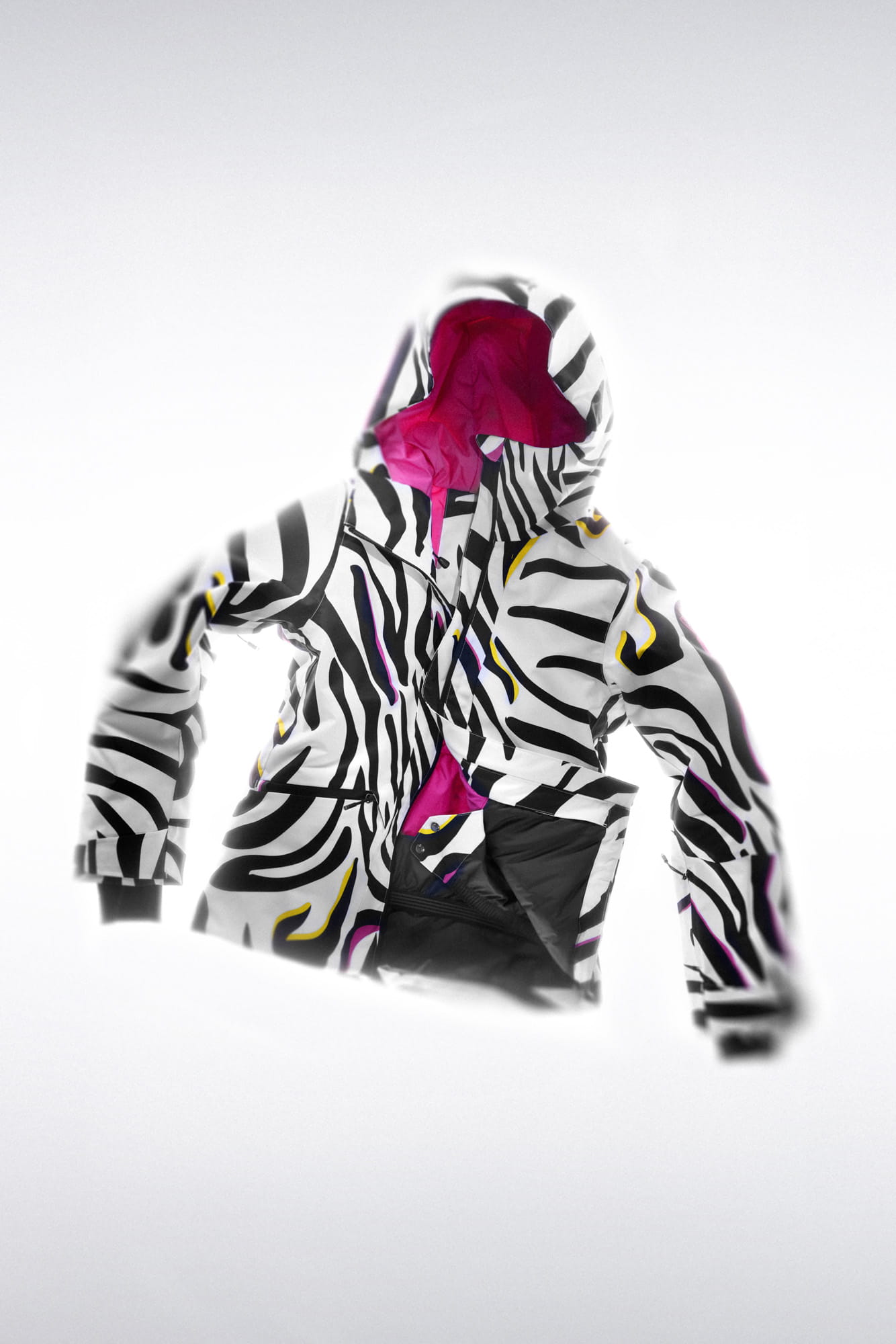Ski jacket with a bold black-and-white patterned design and contrasting pink inner lining, displayed against a white background.